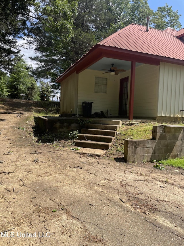 20 Cedar Hts, Pope, MS 38658 - view of side of home with ceiling fan, metal roof, and board and batten siding
