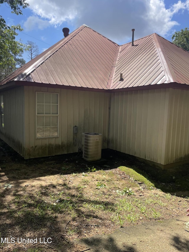 20 Cedar Hts, Pope, MS 38658 - view of side of property featuring metal roof and central AC unit