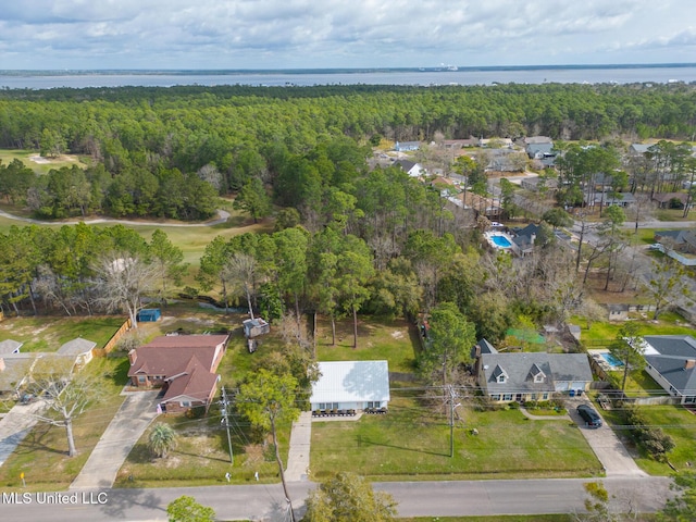 bird's eye view with a wooded view and a water view