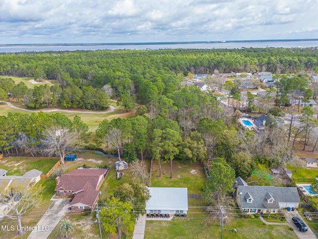 bird's eye view featuring a view of trees and a water view