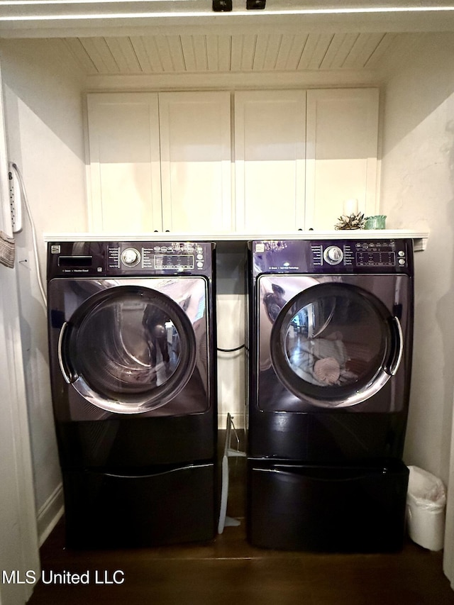 laundry room featuring washer and dryer and cabinet space