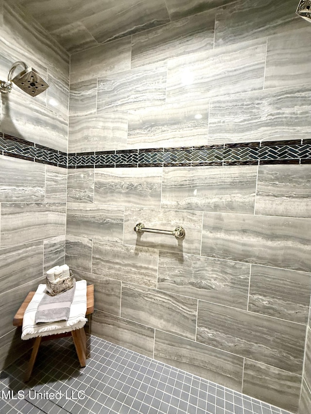 full bathroom with a tile shower