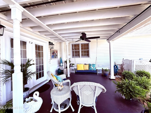 view of patio featuring ceiling fan