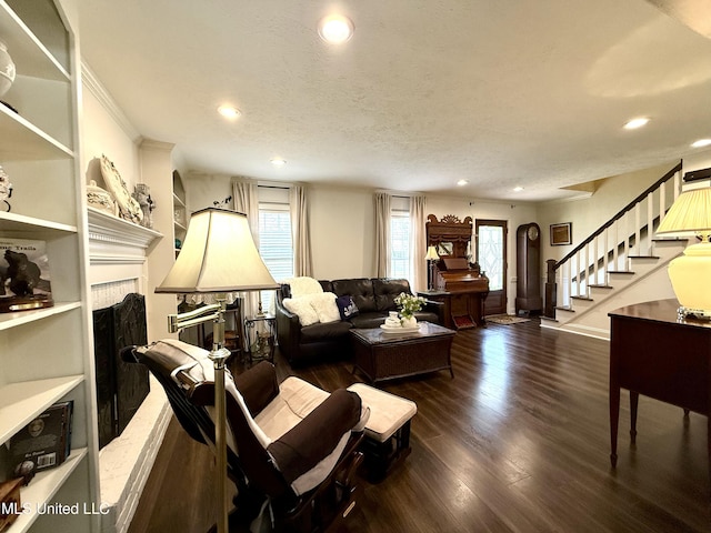 living room with a fireplace, stairway, recessed lighting, and wood finished floors