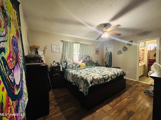 bedroom featuring connected bathroom, ceiling fan, a textured ceiling, and dark hardwood / wood-style floors