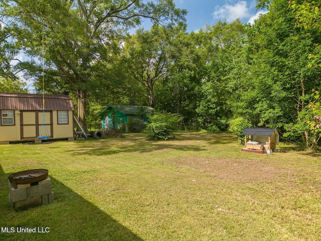 view of yard with a storage unit