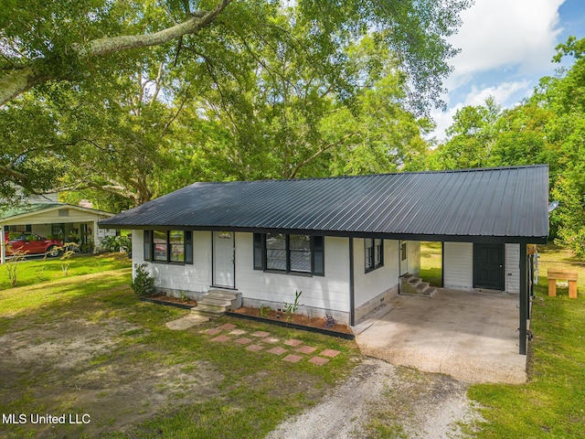 single story home featuring a front yard and a carport