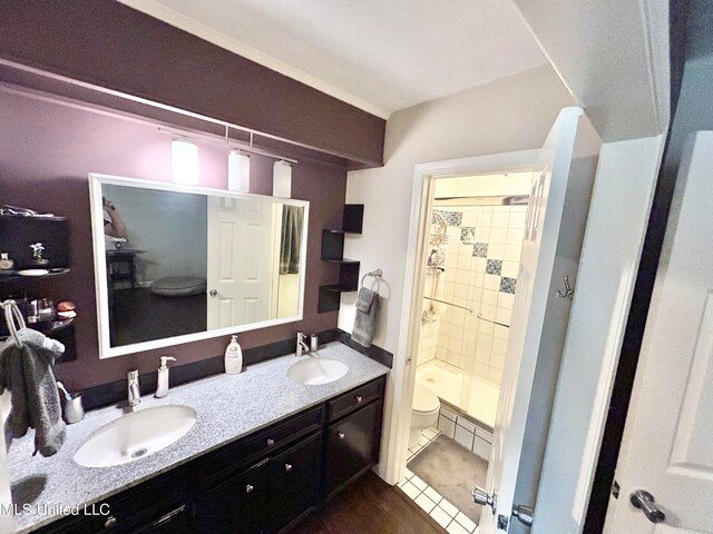 bathroom with a shower with door, toilet, tile patterned flooring, and vanity