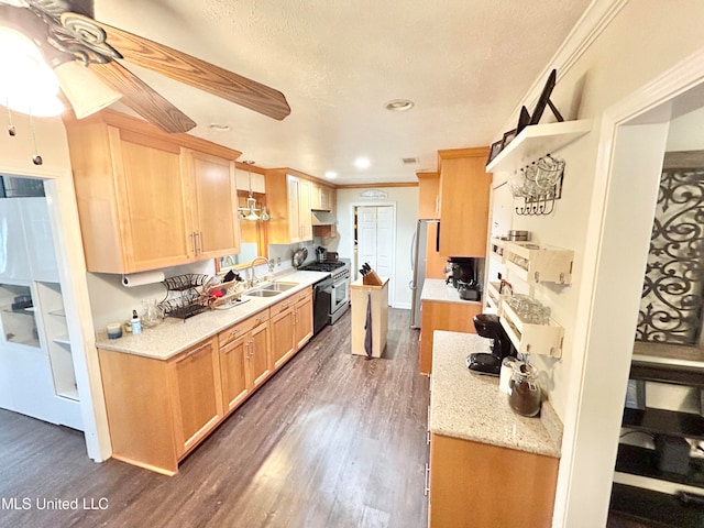 kitchen with stainless steel appliances, pendant lighting, dark hardwood / wood-style flooring, a textured ceiling, and ceiling fan