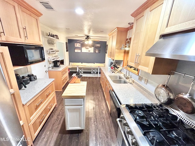 kitchen with exhaust hood, wood counters, light brown cabinetry, dark wood-type flooring, and sink