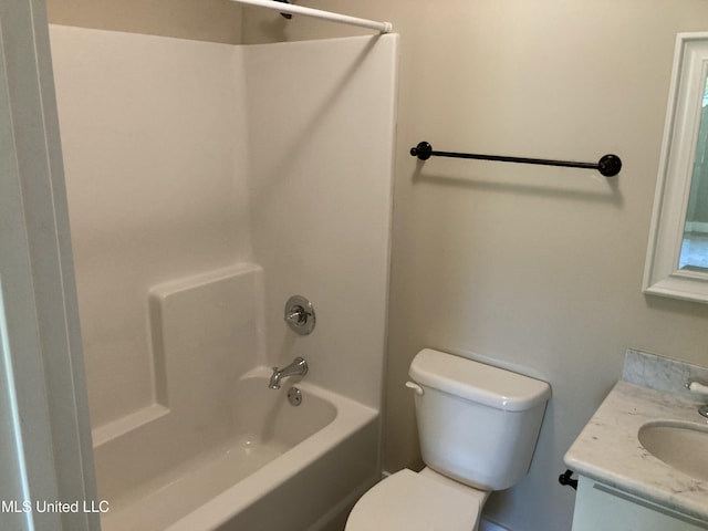 full bath with toilet, vanity, and shower / washtub combination