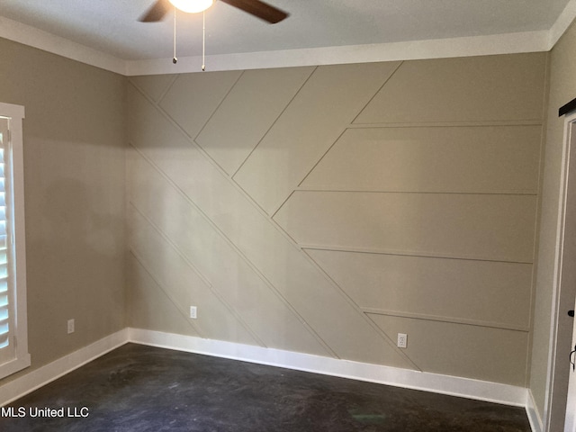 empty room featuring unfinished concrete flooring, ceiling fan, and baseboards