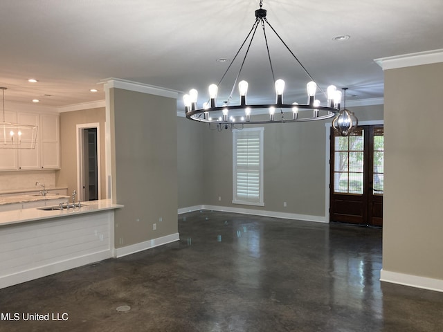 unfurnished dining area with a chandelier, crown molding, baseboards, concrete floors, and recessed lighting