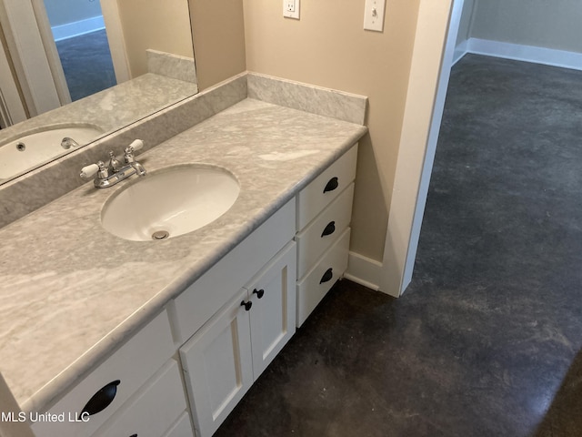 bathroom with finished concrete flooring and vanity