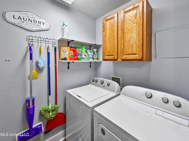 881 Brentwood Dr, Biloxi, MS 39532 - laundry area featuring washer and clothes dryer, cabinet space, and a textured ceiling
