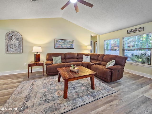 881 Brentwood Dr, Biloxi, MS 39532 - living area featuring ceiling fan, lofted ceiling, a textured ceiling, and wood finished floors