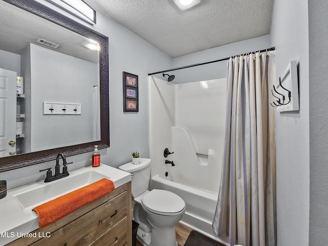 881 Brentwood Dr, Biloxi, MS 39532 - bathroom featuring a textured ceiling, vanity, and shower / tub combo