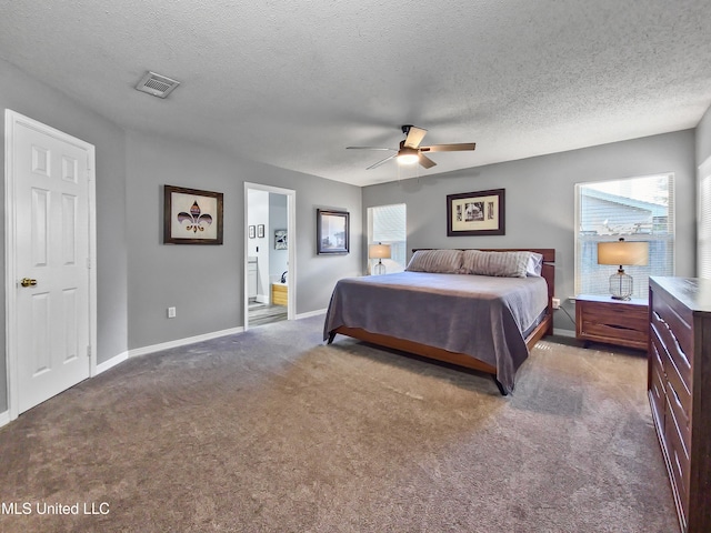 881 Brentwood Dr, Biloxi, MS 39532 - carpeted bedroom with a textured ceiling, ensuite bath, and ceiling fan