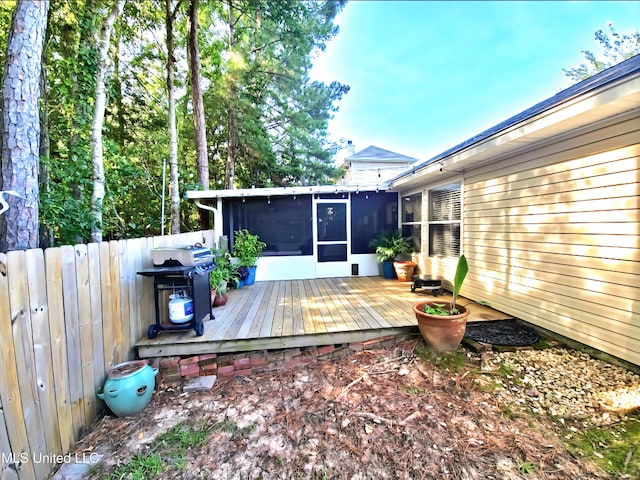 881 Brentwood Dr, Biloxi, MS 39532 - wooden deck featuring a sunroom and a grill