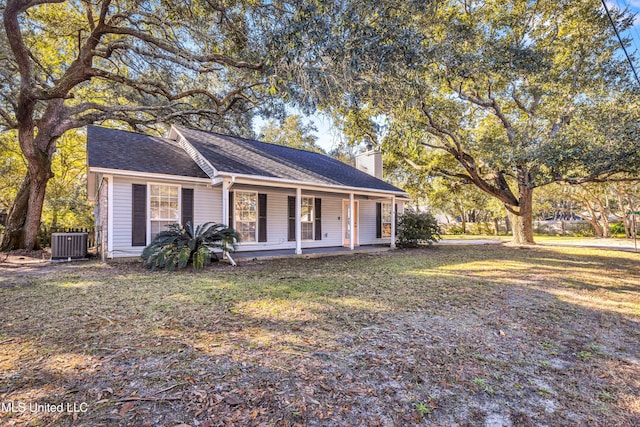 ranch-style home featuring a porch and central air condition unit