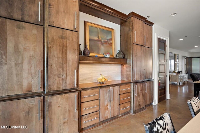 145 Republic St Unit 331, Madison, MS 39110 - detailed view of finished concrete flooring, recessed lighting, and tasteful backsplash