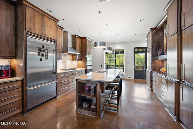 145 Republic St Unit 331, Madison, MS 39110 - kitchen featuring stainless steel appliances, wall chimney exhaust hood, decorative backsplash, finished concrete flooring, and recessed lighting