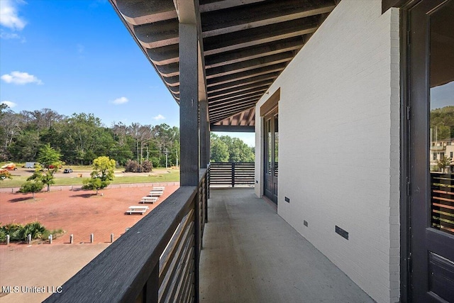 145 Republic St Unit 331, Madison, MS 39110 - view of patio featuring a balcony and view of wooded area