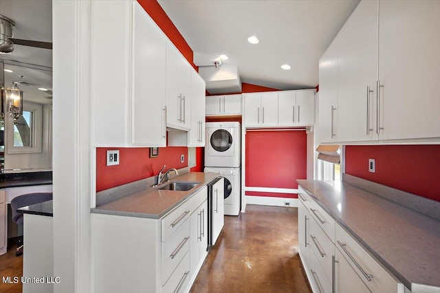 145 Republic St Unit 331, Madison, MS 39110 - kitchen with estacked washer and dryer, a sink, concrete floors, white cabinets, and recessed lighting