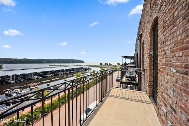 balcony featuring a water view