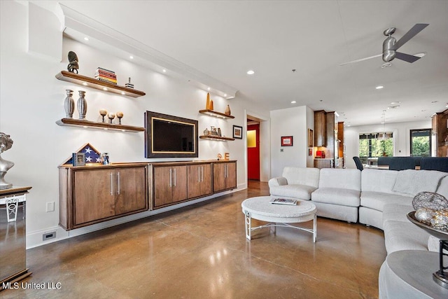 living room with concrete floors and ceiling fan