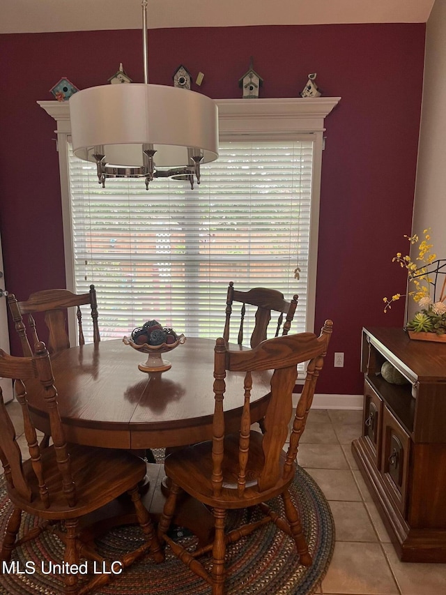 dining area featuring light tile patterned floors