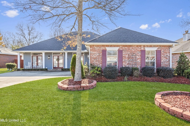 view of front of home with a porch and a front yard