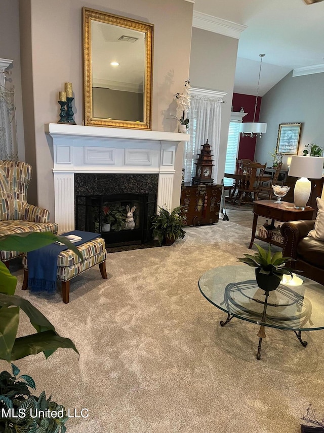 interior space with a high end fireplace, vaulted ceiling, and ornamental molding