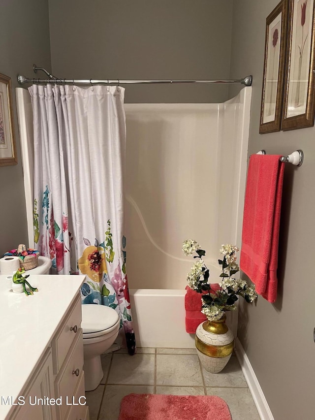 full bathroom featuring tile patterned flooring, vanity, toilet, and shower / tub combo