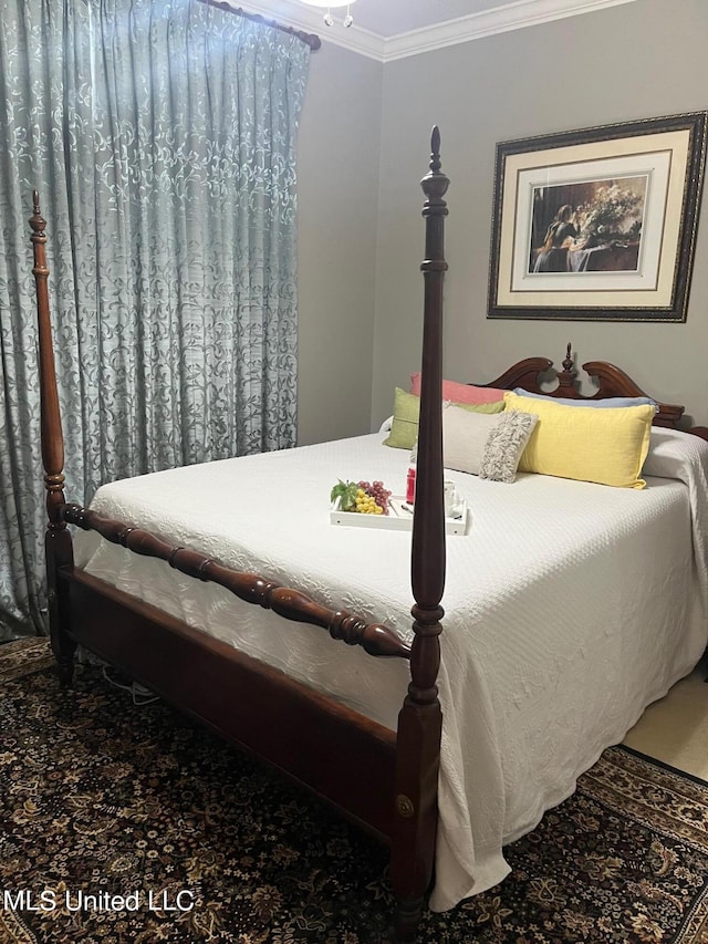 bedroom featuring crown molding