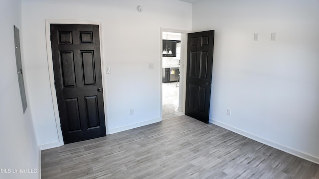 spare room featuring light hardwood / wood-style floors