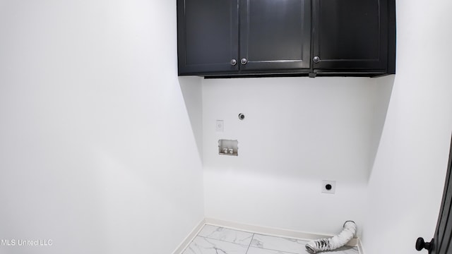 clothes washing area with washer hookup, cabinets, and hookup for an electric dryer