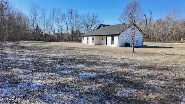 back of property featuring central AC unit