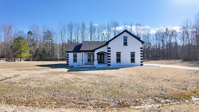 front facade with a front lawn