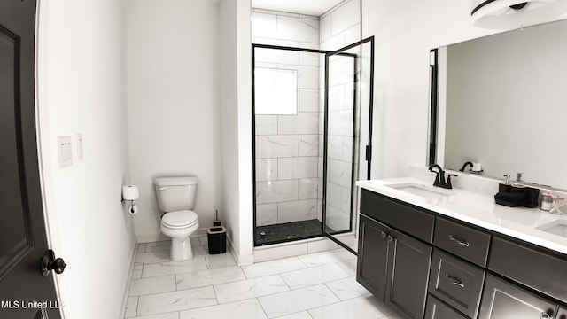 bathroom featuring vanity, toilet, and a shower with shower door