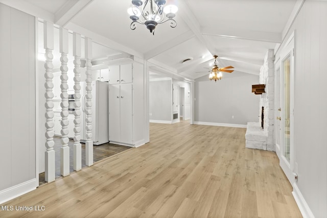 unfurnished living room with vaulted ceiling with beams, baseboards, light wood finished floors, and ceiling fan with notable chandelier