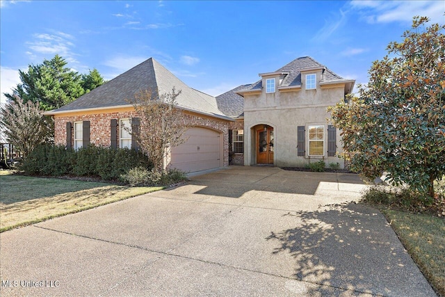 french country inspired facade with a garage