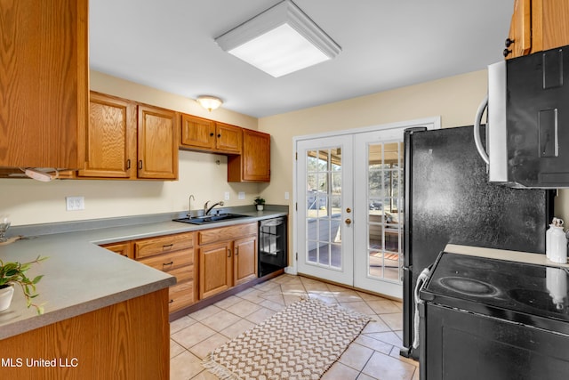 kitchen featuring french doors, light tile patterned floors, light countertops, a sink, and black appliances