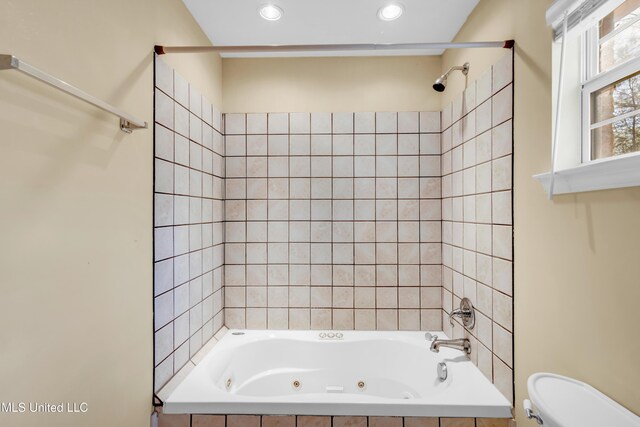 full bath with recessed lighting, a combined bath / shower with jetted tub, and toilet