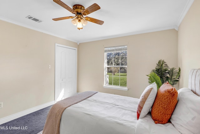 bedroom featuring baseboards, visible vents, a ceiling fan, ornamental molding, and carpet flooring