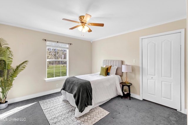 carpeted bedroom with a ceiling fan, baseboards, and crown molding