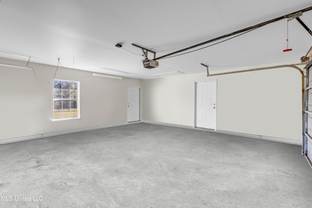 garage featuring baseboards and a garage door opener