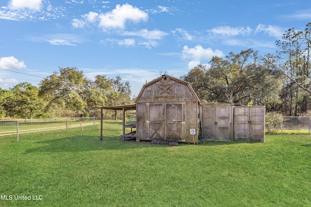 view of shed with a fenced backyard