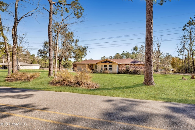 view of front facade with an attached garage and a front lawn