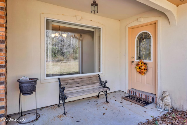 property entrance with brick siding